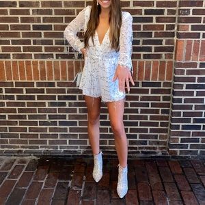 White, silver fringe romper. Size medium.